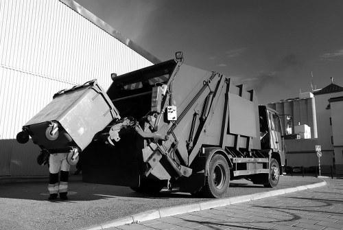 Professionals performing loft clearance in a Woking home