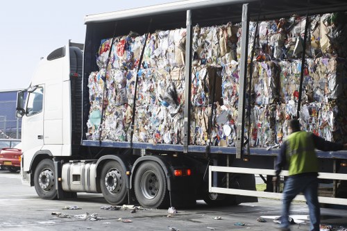 Local waste removal service vehicles in Woking